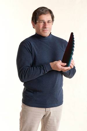 Frank Fish with a model of a humpback whale fin