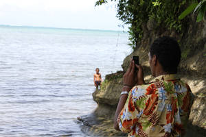 Student filming in Fiji