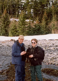 Bruce Wright accompanied Jane Lubchenco, the past president of the American Association for the Advancement of Sciences (AAAS), on a trip to one of Alaska's remote beaches. Lubchenco, a marine ecologist, is inspecting some marine algae washed up on shore by winter storms.