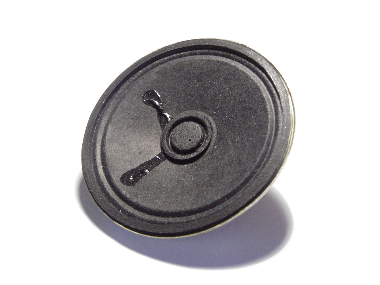 An inexpensive low fidelity 3.5 inch speaker, typically found in small radios