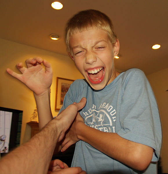 Boy being tickled