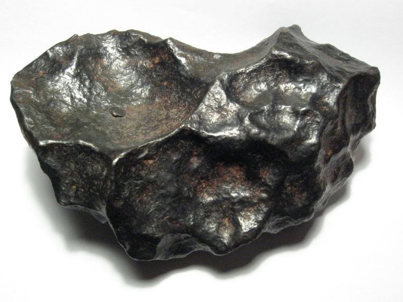 A 4.5kg individual meteorite from the Gibeon meteorite field. Gibeon is a fine octahedrite, class IVA. This specimen is about 19cm wide.