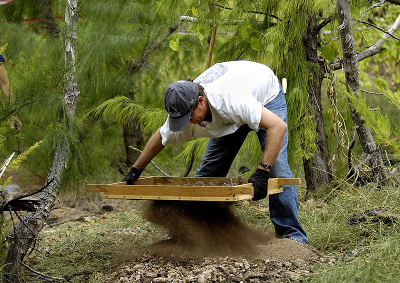  Servicemembers search for POW/MIAs on Wake Island Greg Berg uses a sifter to look for bone and artifacts at a dig site Jan. 12 on Wake Island. Mr. Berg, a forensic anthropologist, was sent to do a site survey after Wake Island officials notified the...