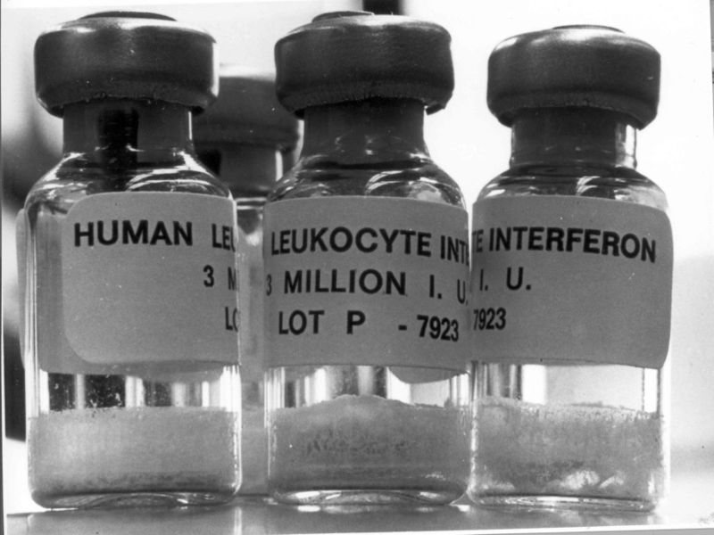 Three vials filled with human leukocyte interferon.