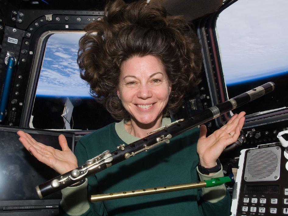 NASA's Cady Coleman playing the flute in space