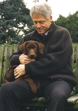 Persident Bill Clinton getting acquainted with Buddy on the South Lawn, December 5, 1997.