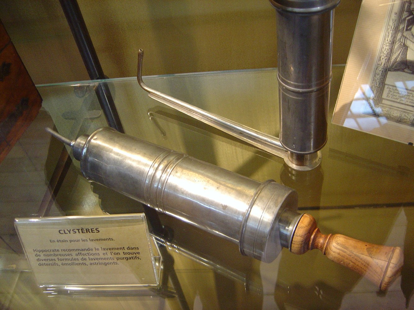 Some clyster (enema) syringes, the one in the back has a nozzle designed for self-administration.