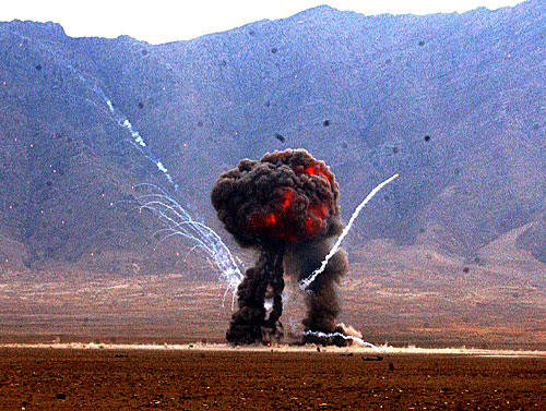 A weapons cache is detonated at the East River Range on Bagram Airfield, Afghanistan, Dec. 2, 2004. The cache was destroyed by airmen of the U.S. Air Force's 455th Explosive Ordnance Group.