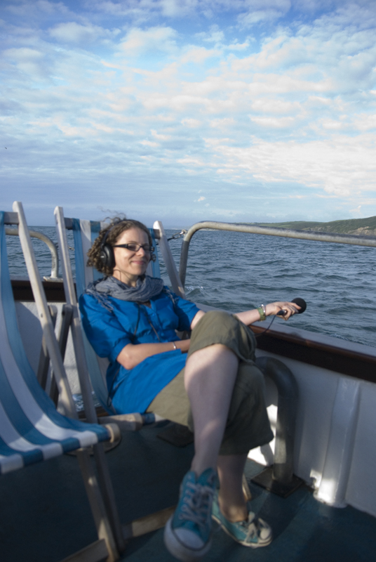 Helen Scales recording at sea