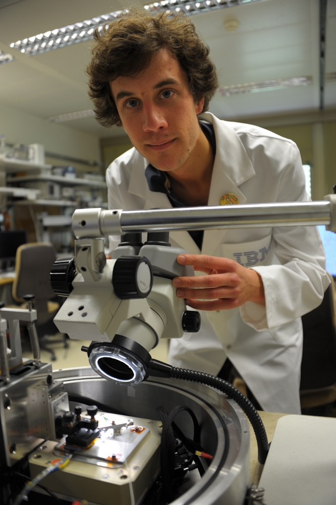 IBM scientist Colin Rawlings makes adjustments to nanopatterning tool.