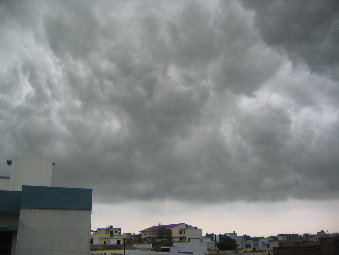 A photo of dark stormy monsoon clouds over the city of Lucknow,India.