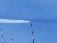 What is the dark line extending in front of the plane?
