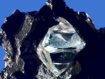A slightly misshapen octahedral diamond crystal in matrix.