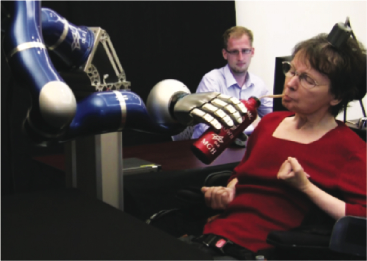 Participant S3 drinking from a bottle using the DLR robotic arm. 