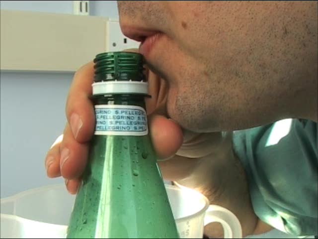 Blowing across a bottle to make a note