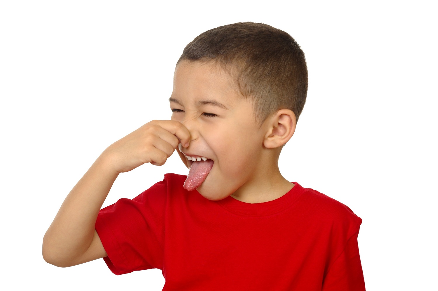 Kid smelling something bad and holding his nose