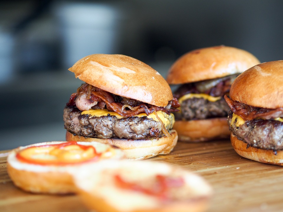 A few burgers on a table