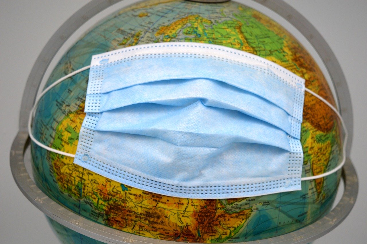 Globe wearing a facemask