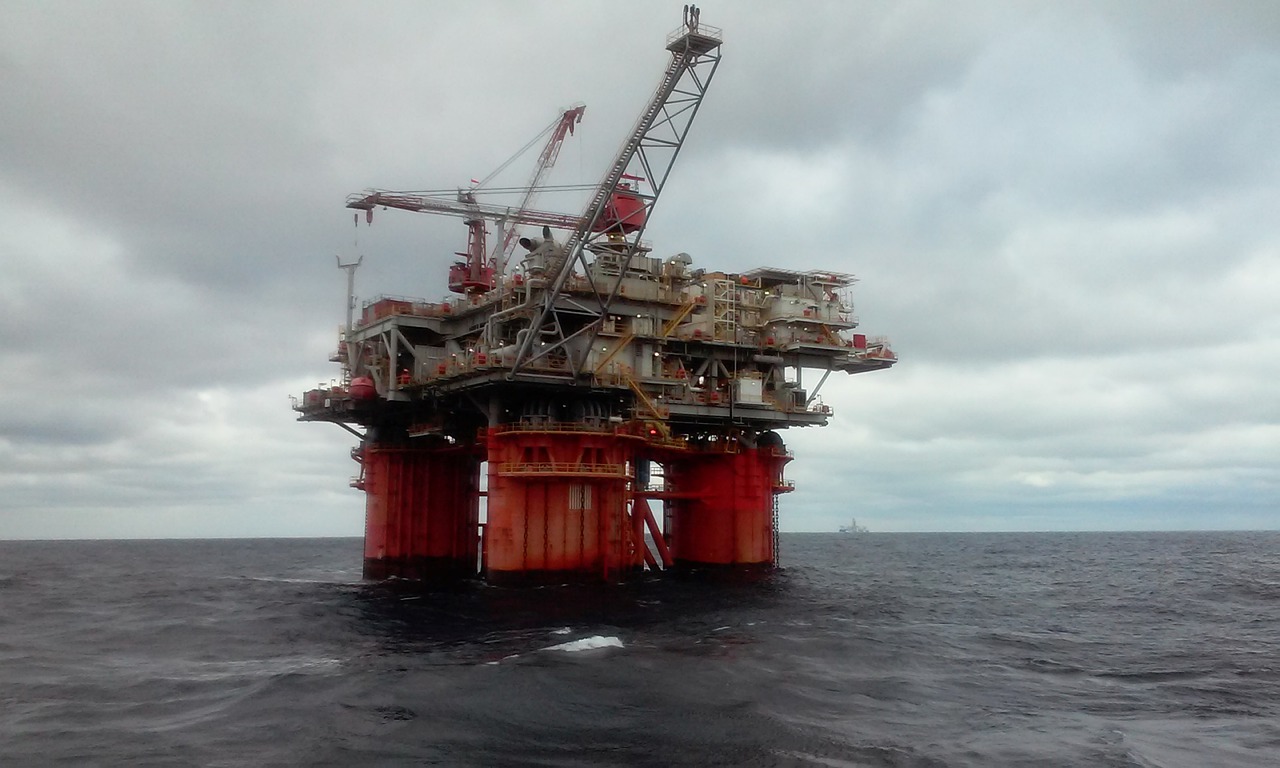 An oil rig in the ocean.