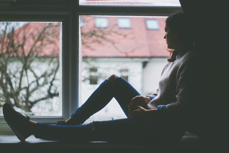 Woman sitting in the window