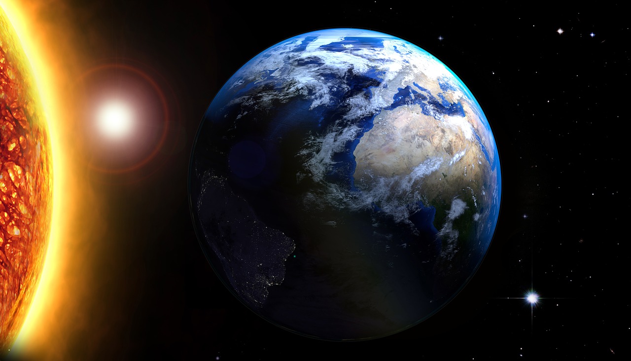 The Earth in space orbiting round the sun.