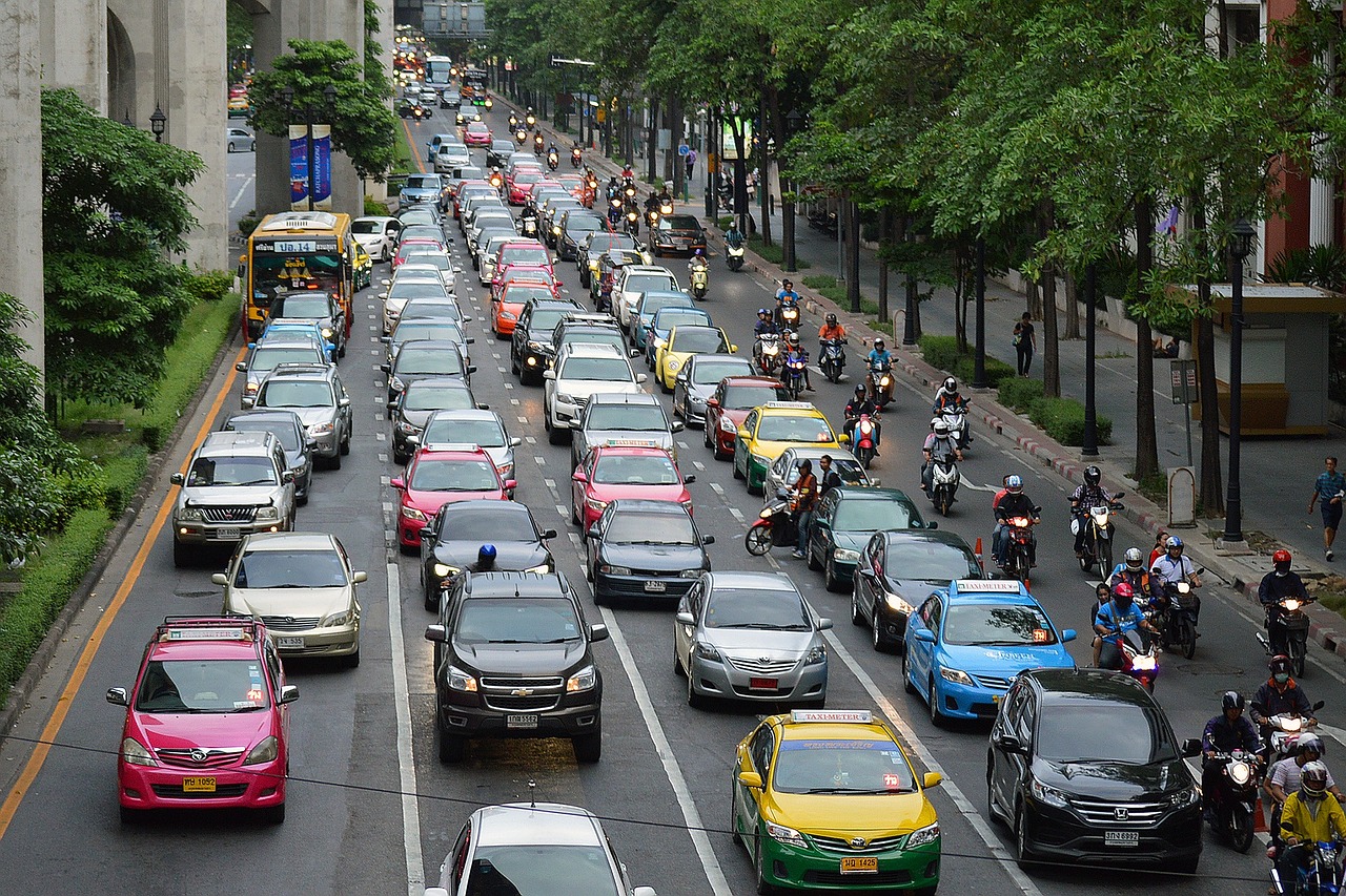 A road busy with car traffic.