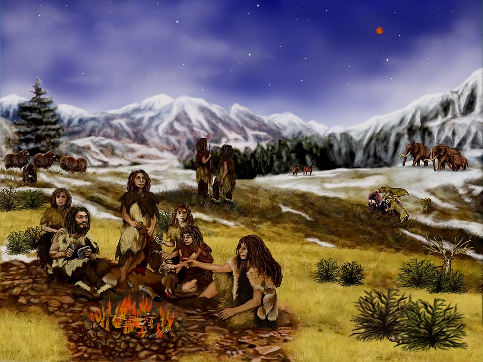 Snowy landscape with a group of early humans.