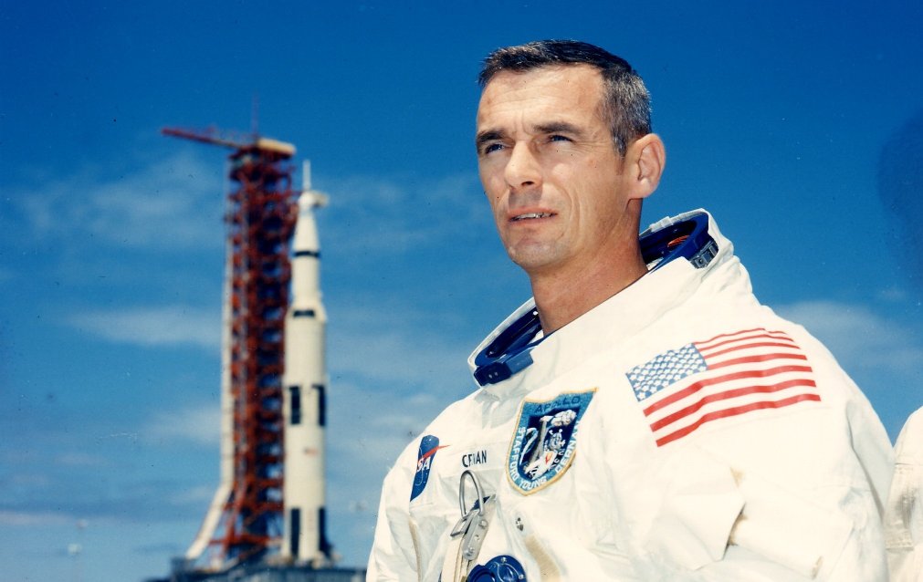 Astronaut Gene Cernan in front of a rocket
