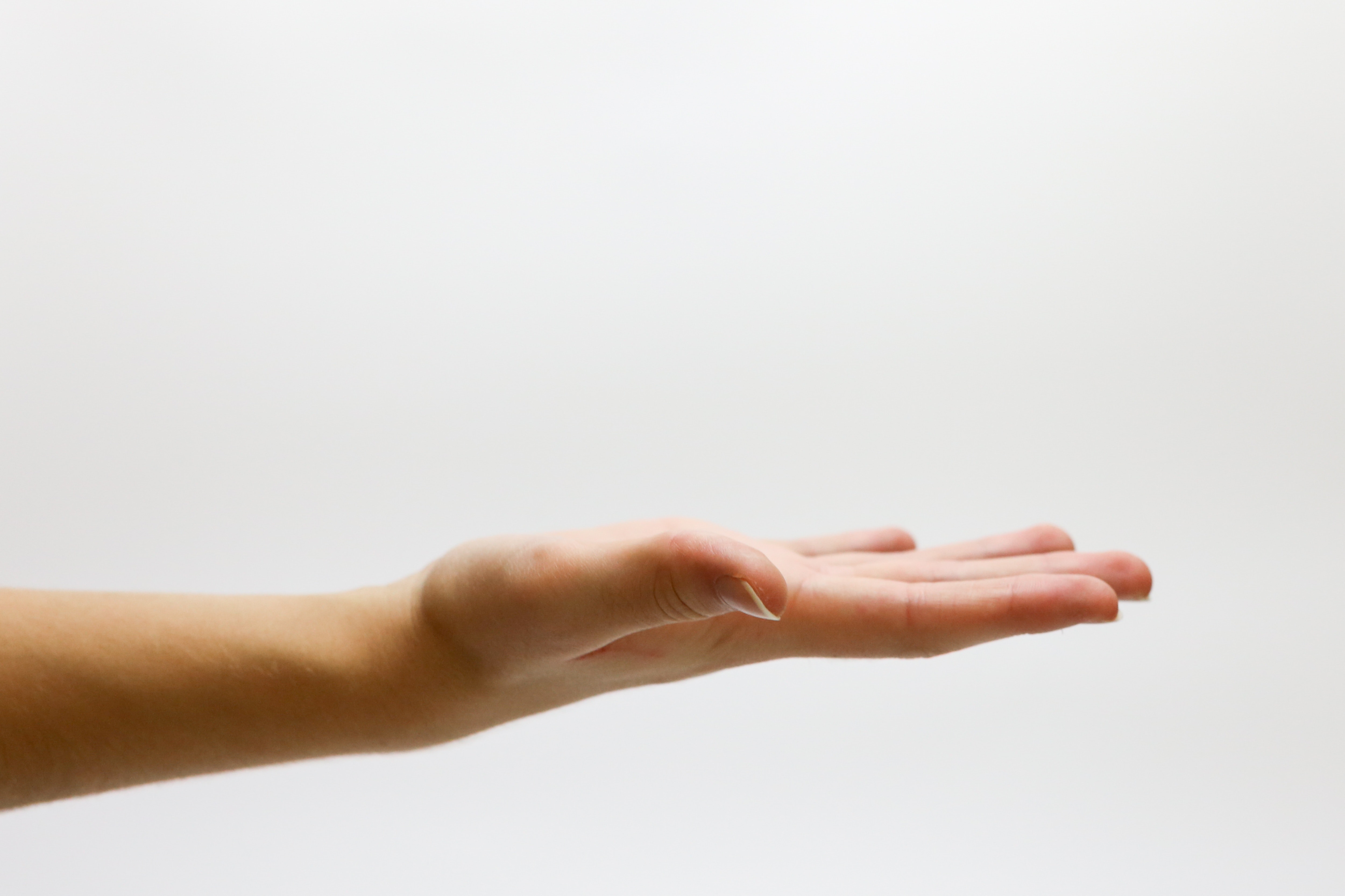 An outstretched hand, palm-up