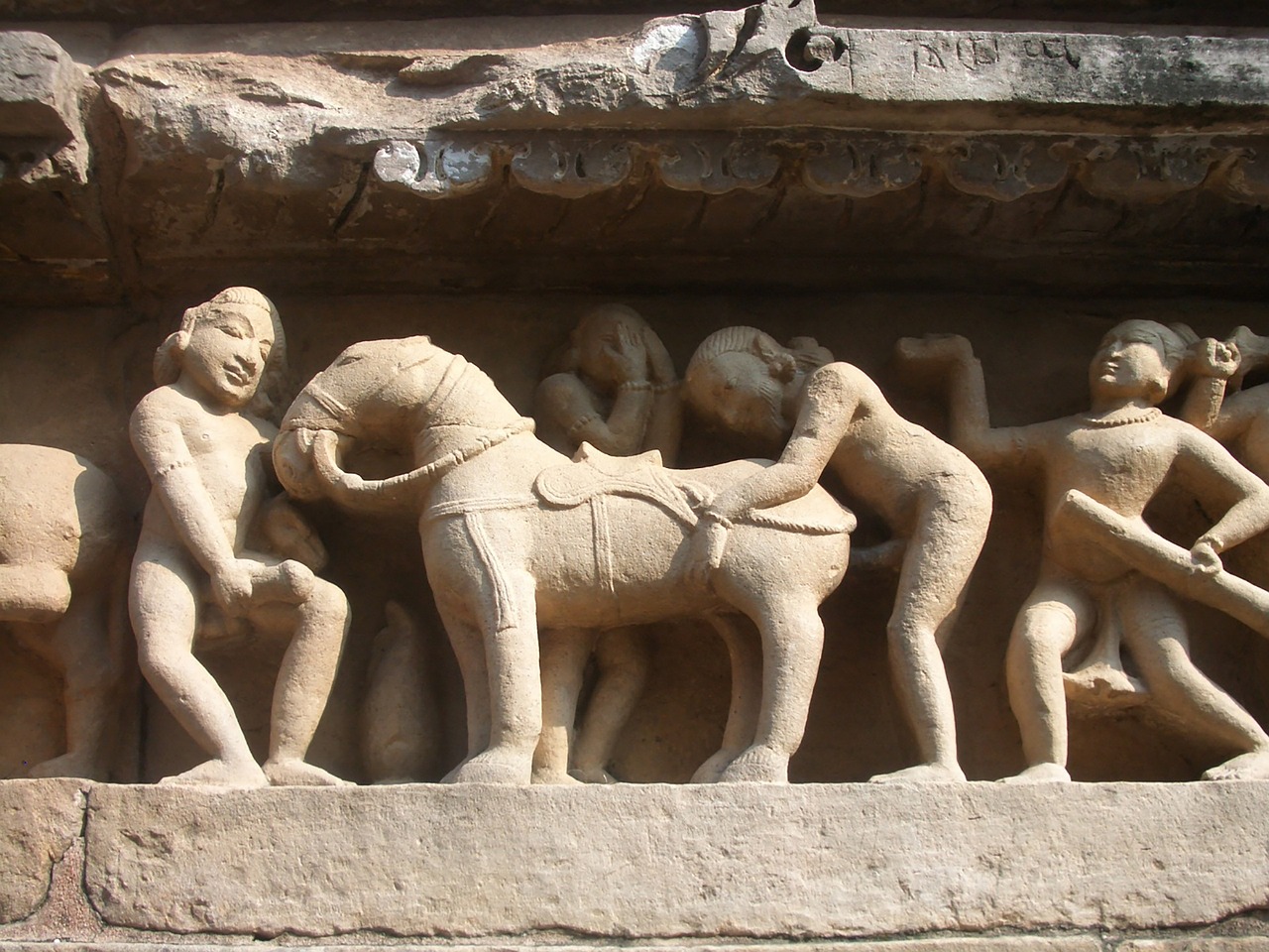 Ancient stone relief depicting sex acts