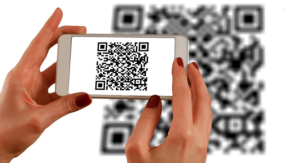 QR code being read by phone in hands