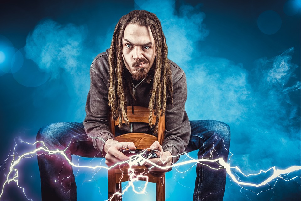 A man sitting on a chair holding a game controller with lightning coming out of it