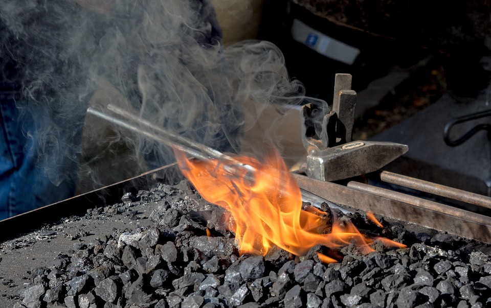 Sword sitting in a forge's embers 