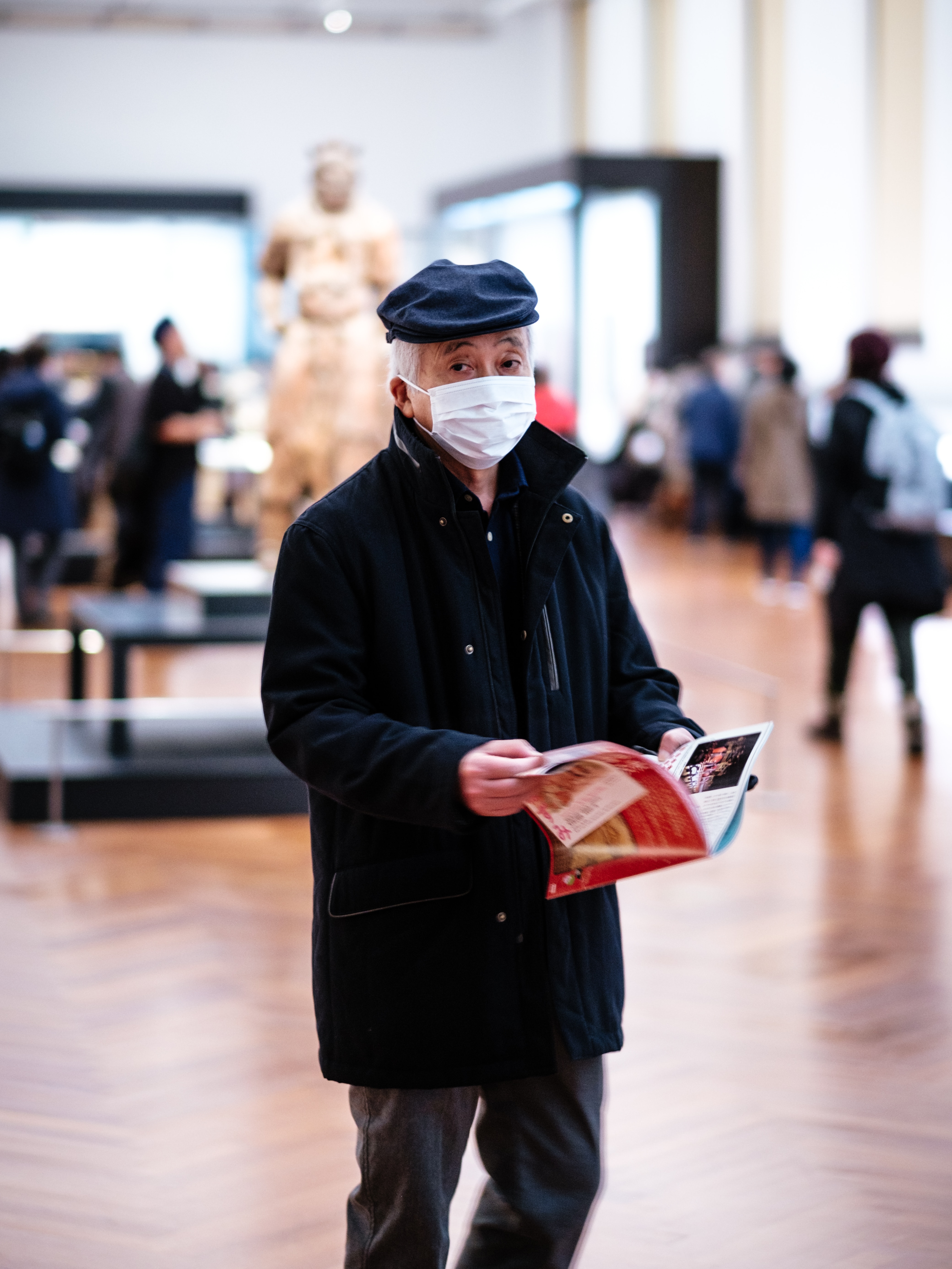Person wearing a facemask to protect from viral infection