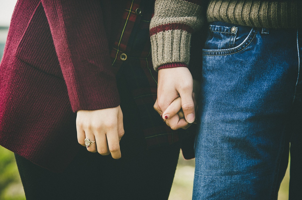 Couple holding hands