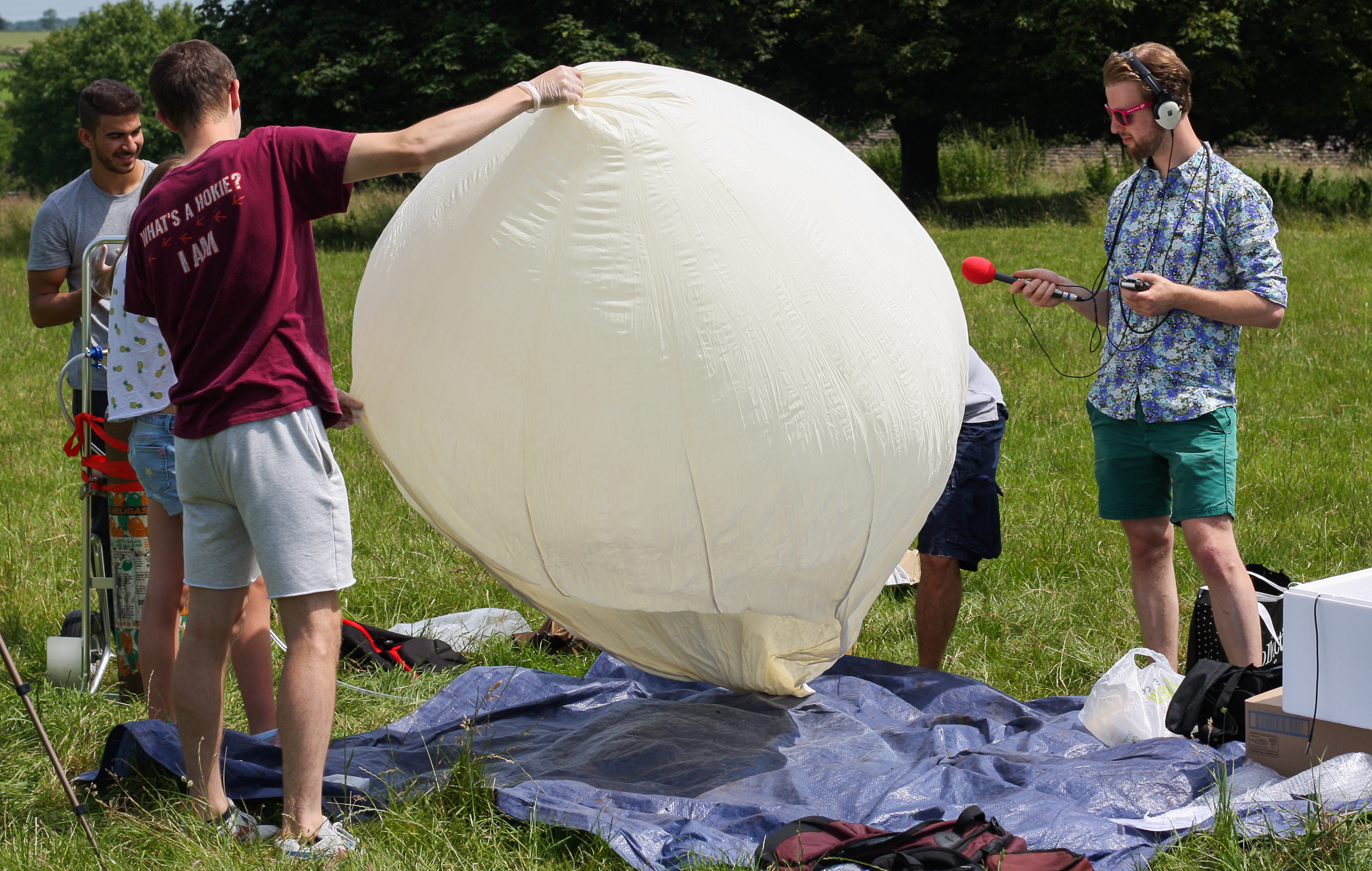 The team begin to inflate the helium balloon that will carry the screams to the edge of space
