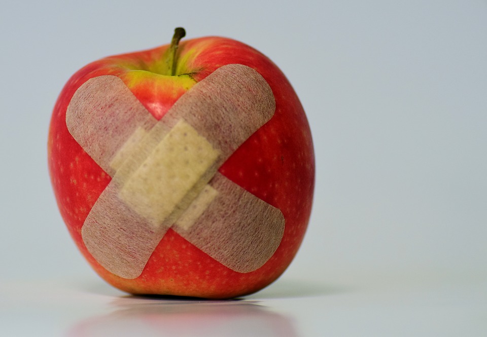 Apple with a plaster