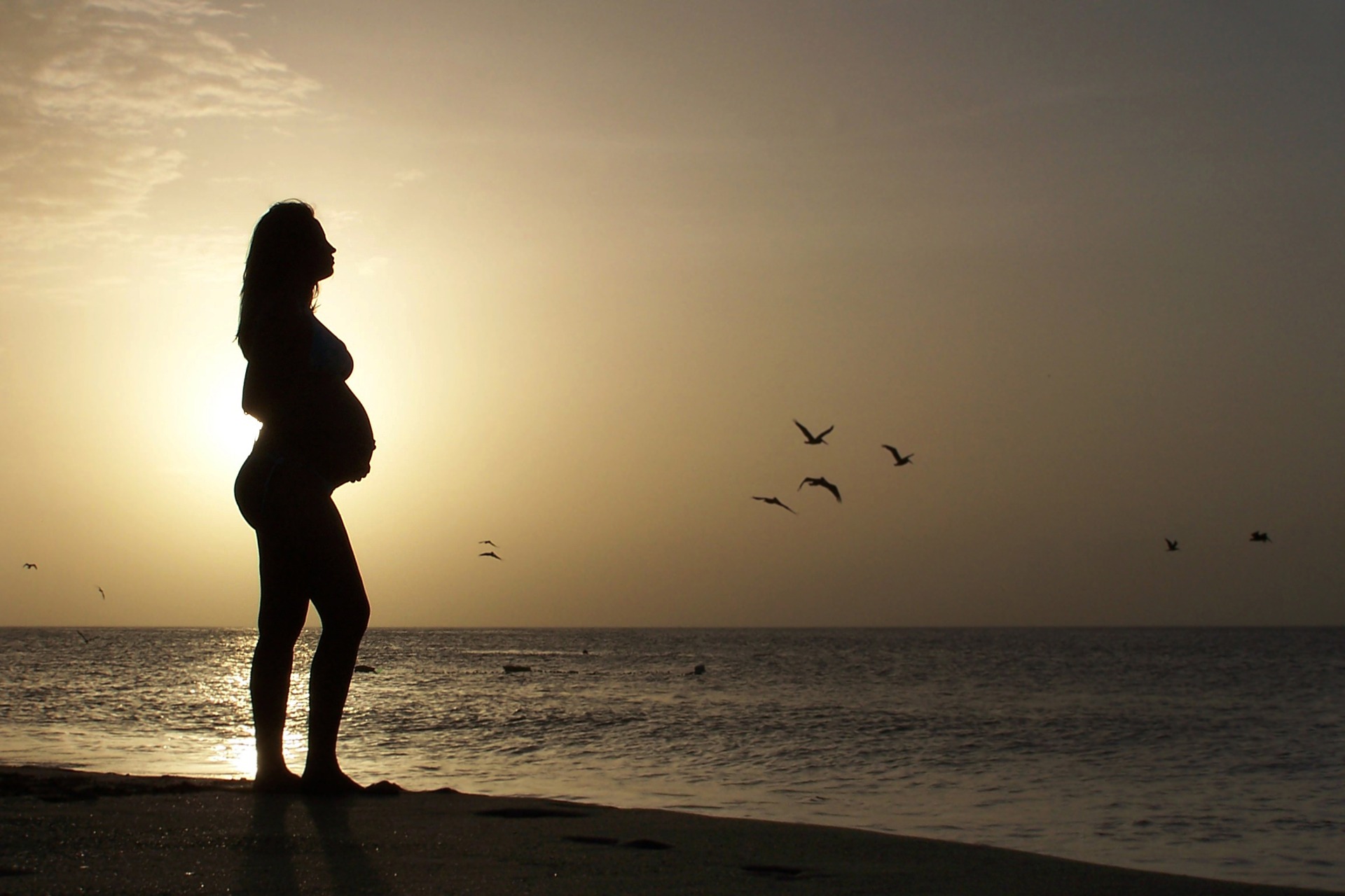 Pregnant woman on a beach