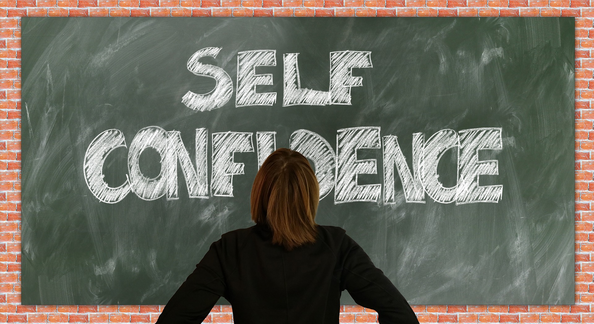 Self confidence written on a blackboard