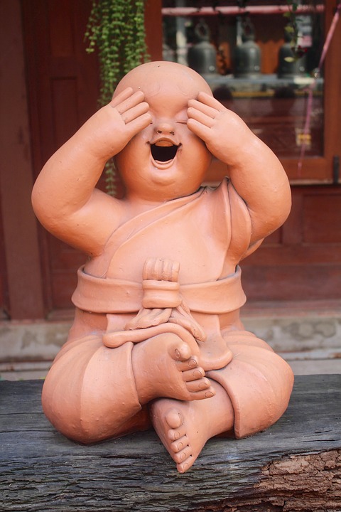 Laughing meditation statue