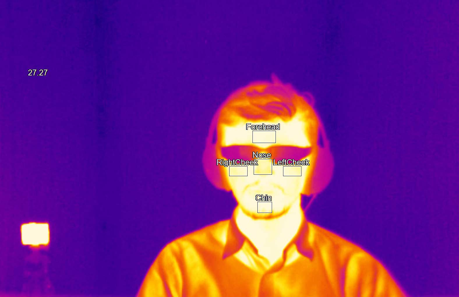 Thermal camera image of a person wearing glasses. 