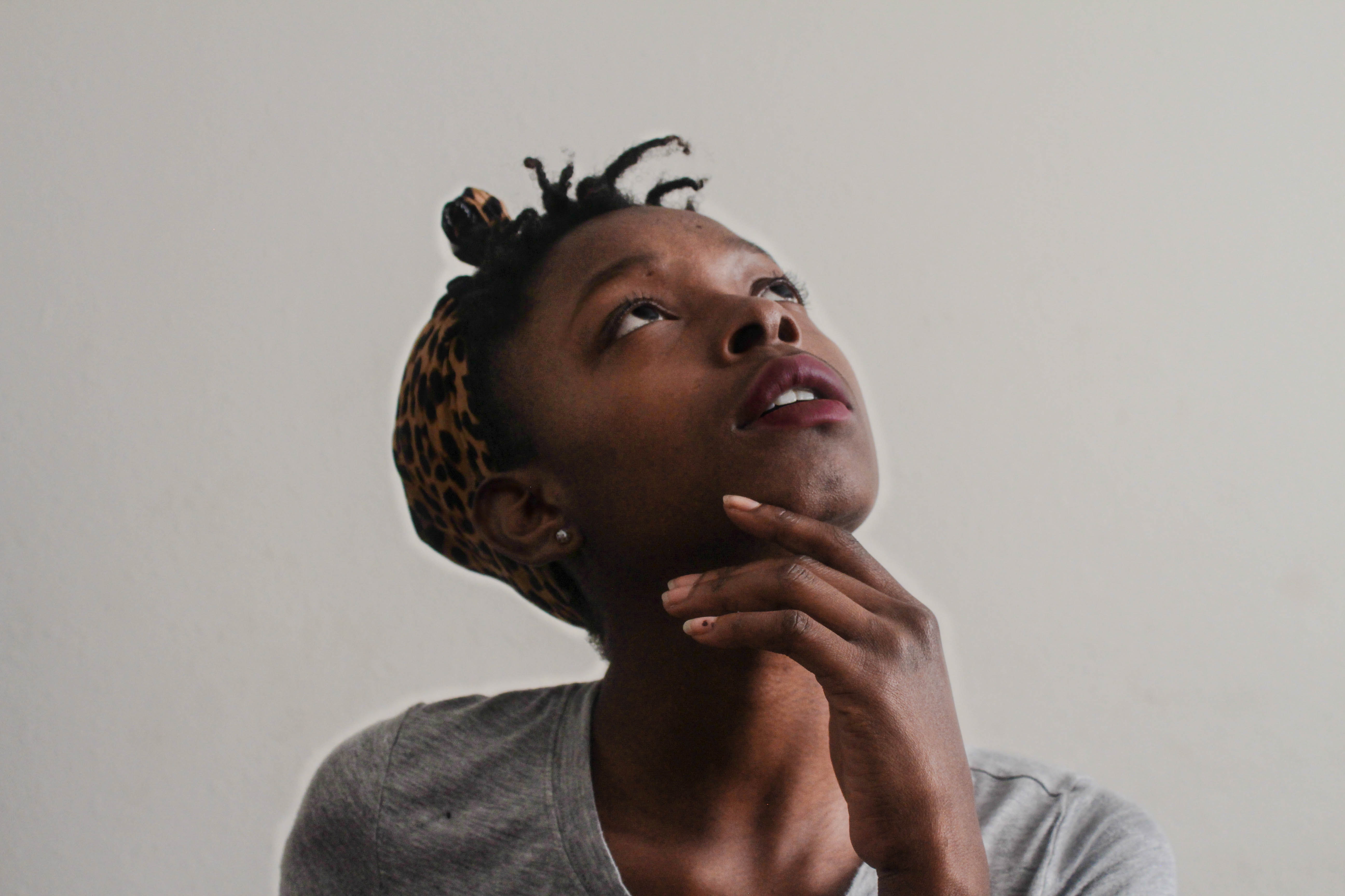 Woman looking up in thought