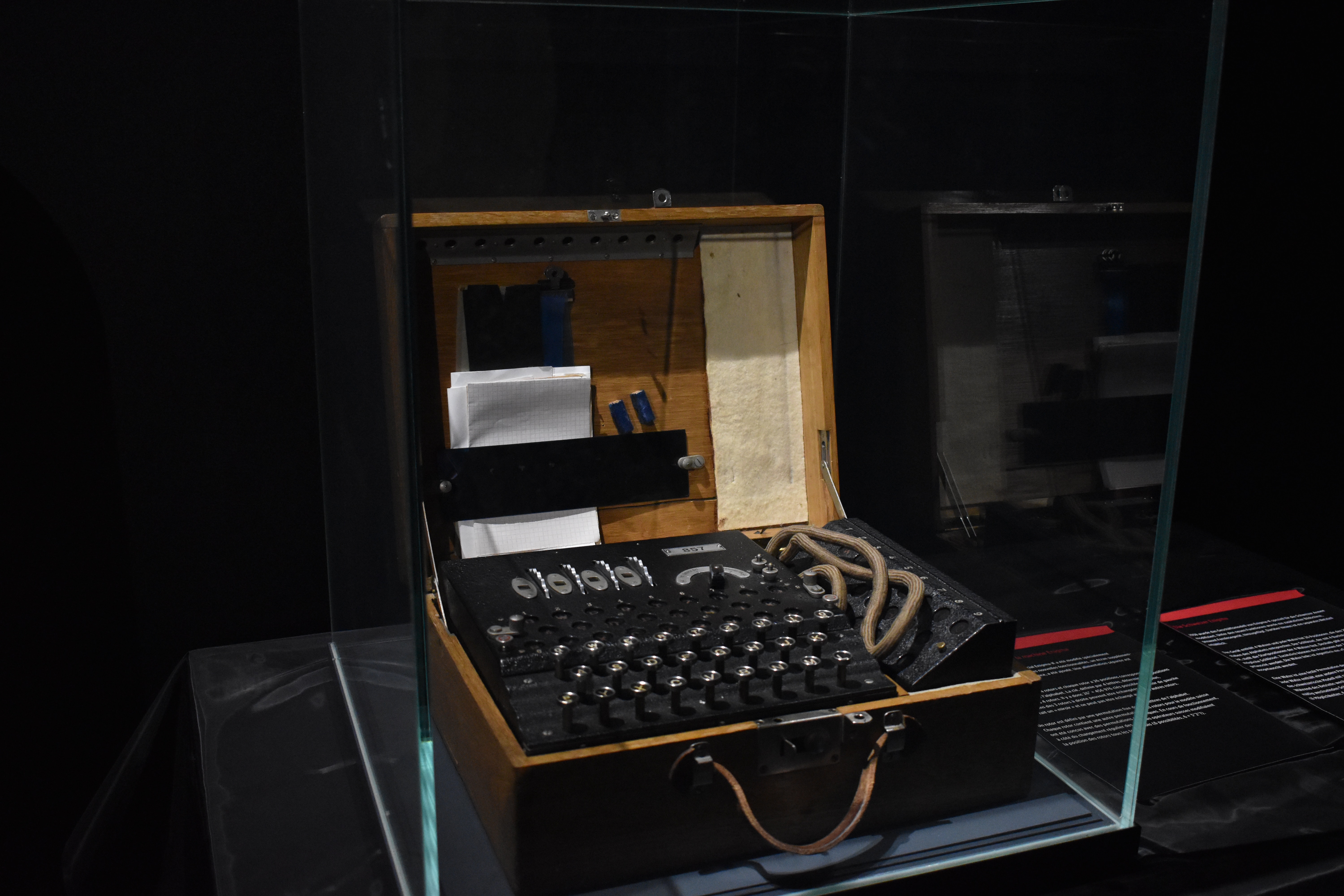 An enigma codebreaking machine behind glass