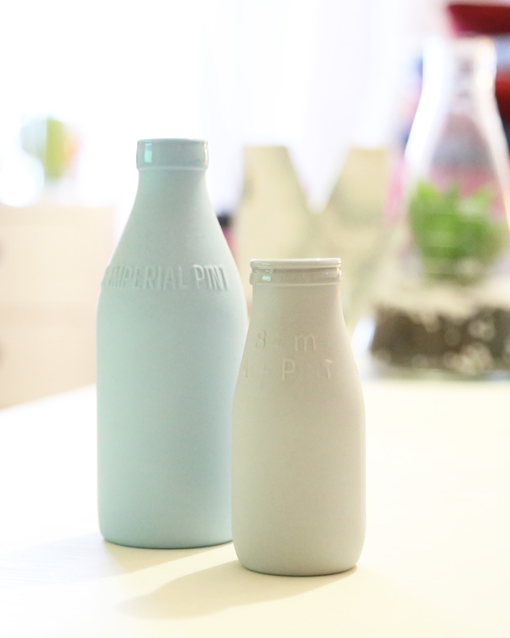 Two dairy bottles.