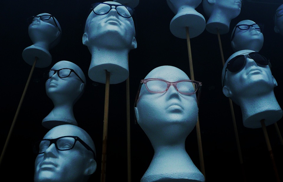 Styrofoam heads, wearing glasses