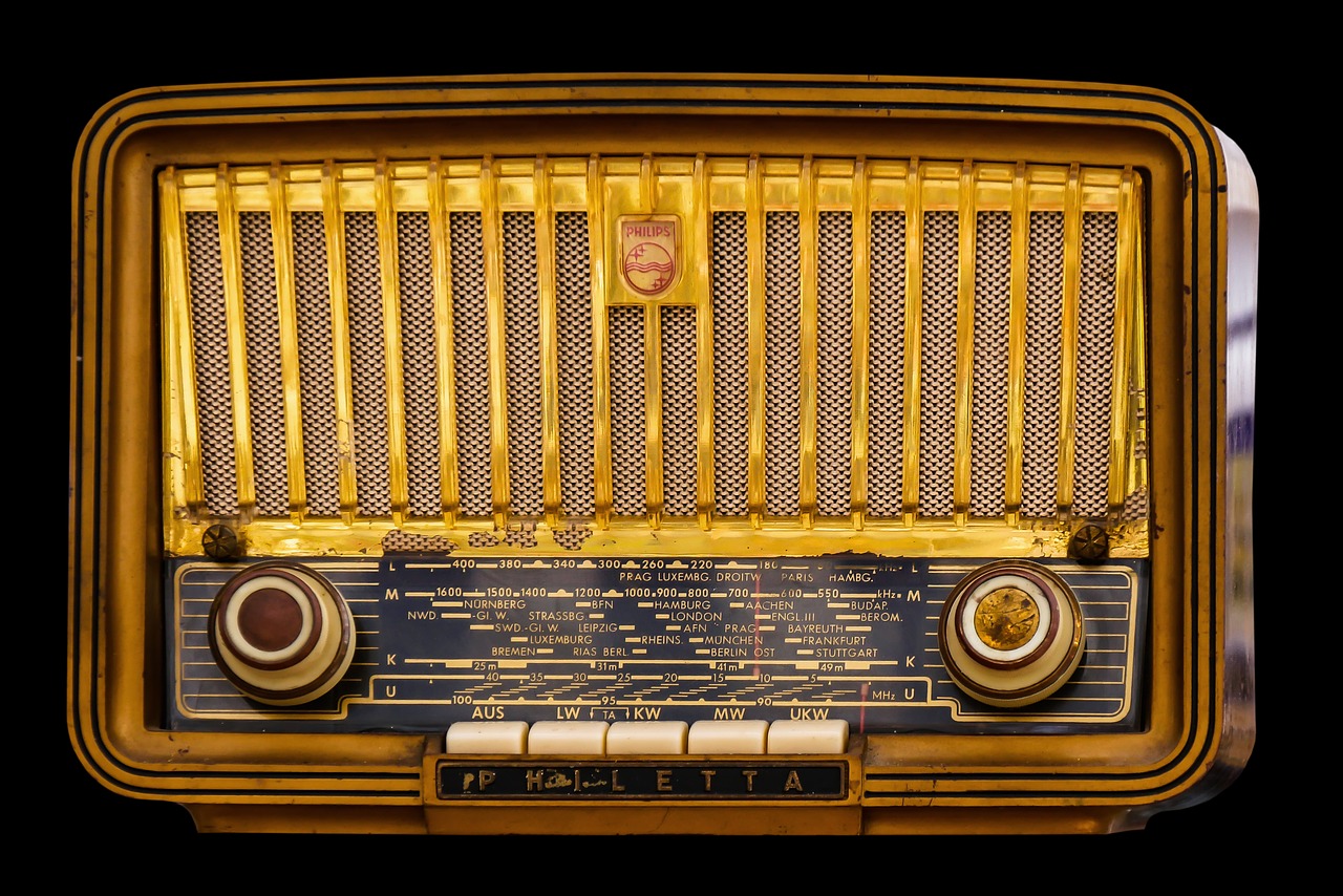 A vintage brown and gold tube radio,