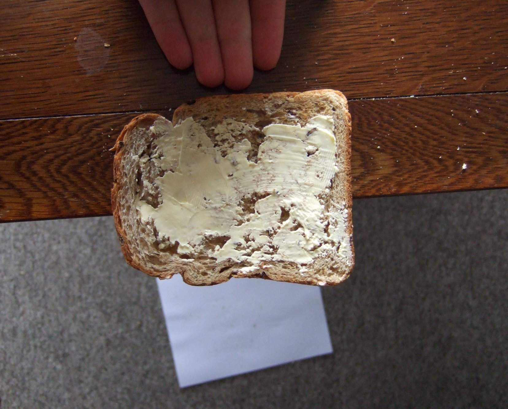 Pushing toast of table