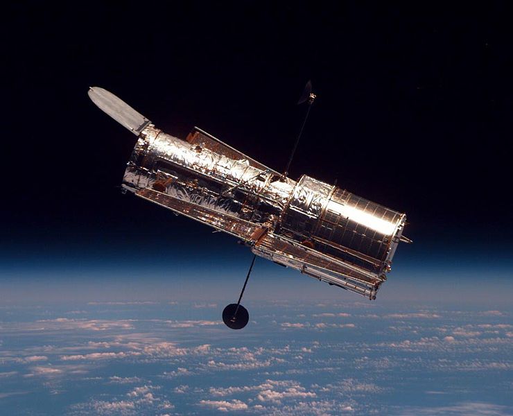 The Hubble Space Telescope (HTS) begins its separation from Space Shuttle Discovery following its release on mission STS-82.