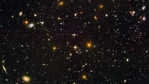 Figure 4: Hubble Ultra Deep Field. Recently, astronomers using the Hubble unveiled the deepest look into the universe yet, showing what could be the most distant and the youngest galaxies ever seen.