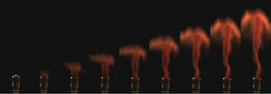 Sequential still frames from a video filmed at 10,000fps. Each frame is 1/10,000 of a second. The mushroom cloud with a trailing wake is clearly visible.
